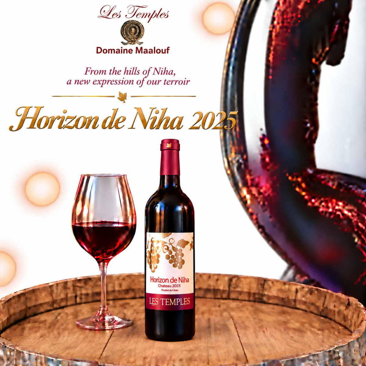 Les Temples Horizon de Niha Château 2025 red wine bottle and glass on an oak barrel